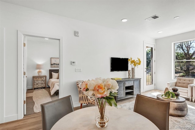 living room with light hardwood / wood-style flooring