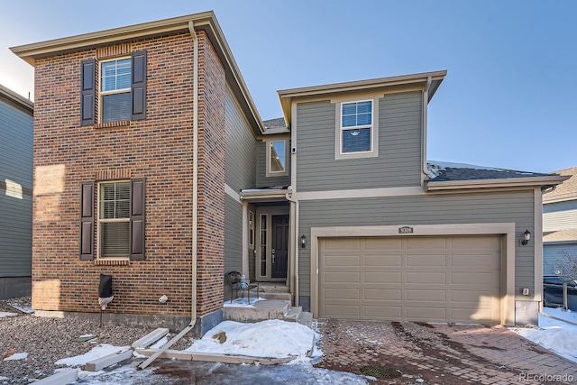 front of property with a garage