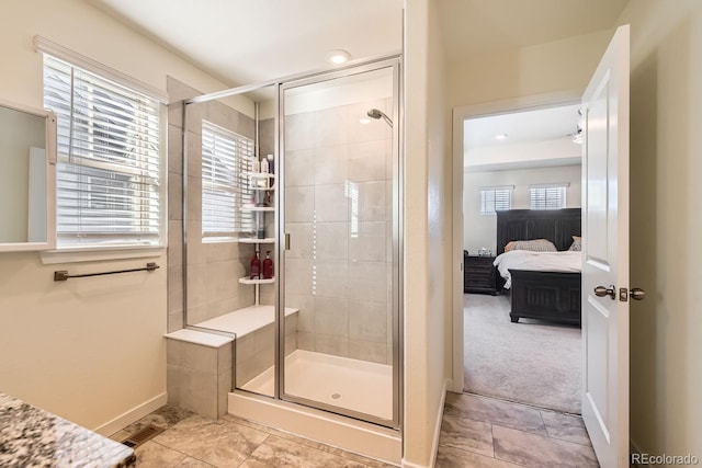 bathroom featuring a shower with shower door