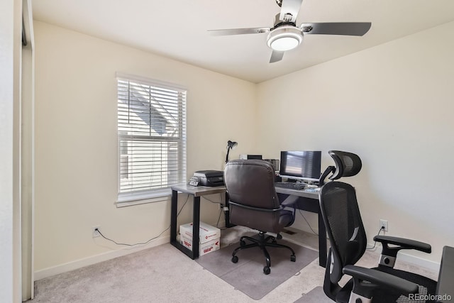 office area featuring ceiling fan and light carpet