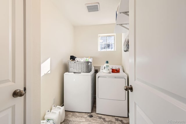 laundry room with washing machine and dryer