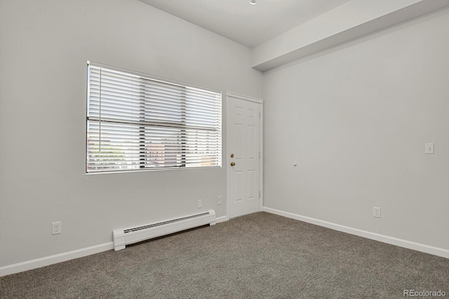 505 E 24th St Unit 204, Denver, CO 80205 - spare room with a baseboard heating unit and carpet floors