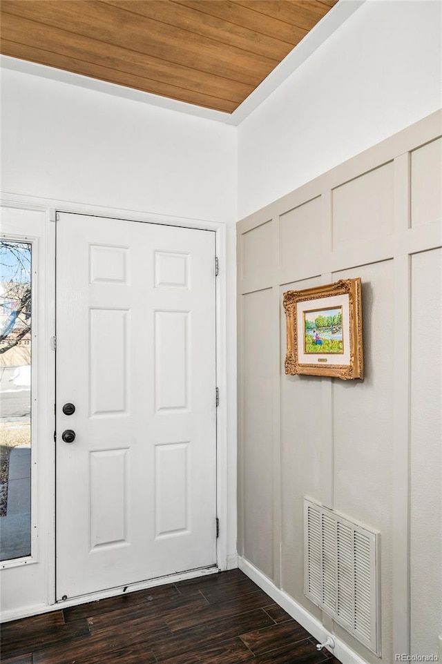 foyer featuring dark hardwood / wood-style flooring and wood ceiling