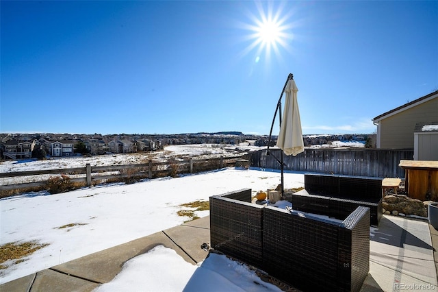 view of snow covered patio