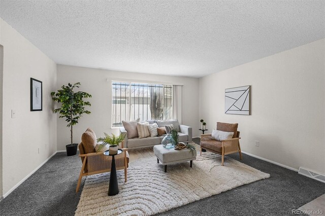 1280 Sable Blvd, Aurora, CO 80011 - living room with a textured ceiling, carpet, visible vents, and baseboards