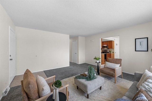 1280 Sable Blvd, Aurora, CO 80011 - living area featuring baseboards, visible vents, a textured ceiling, and light colored carpet