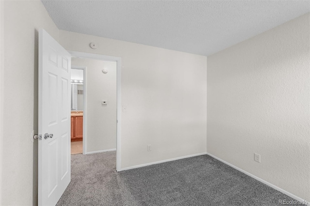 1280 Sable Blvd, Aurora, CO 80011 - carpeted spare room with baseboards and a textured ceiling