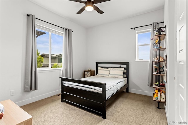 9391 E 59th N Pl, Denver, CO 80238 - bedroom with light colored carpet, multiple windows, and ceiling fan
