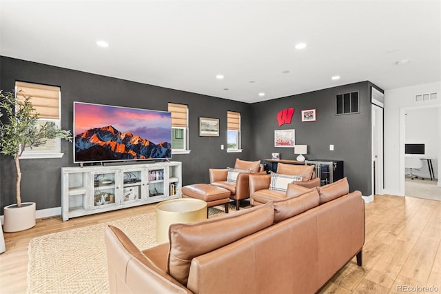 9391 E 59th N Pl, Denver, CO 80238 - cinema featuring an accent wall, wood finished floors, and recessed lighting