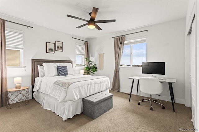 9391 E 59th N Pl, Denver, CO 80238 - carpeted bedroom featuring multiple windows, a desk, a ceiling fan, and a closet