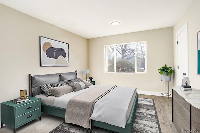 bedroom with light wood finished floors