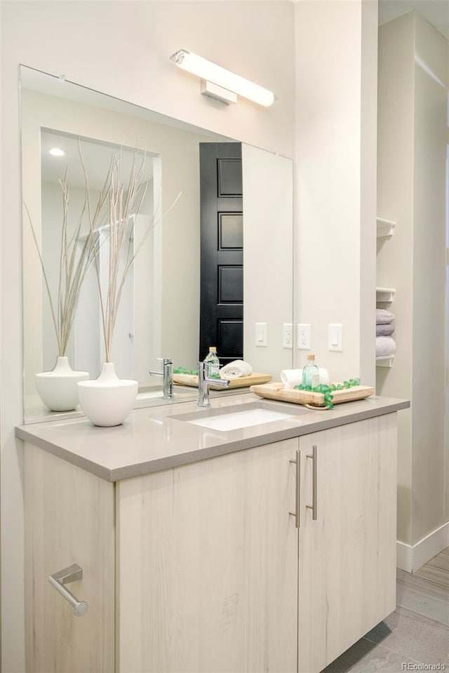 3198 Blake St Unit 502, Denver, CO 80205 - bathroom with vanity and baseboards