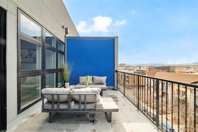 3198 Blake St Unit 502, Denver, CO 80205 - balcony with outdoor lounge area and a mountain view