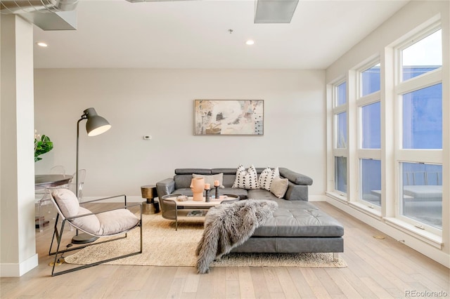3198 Blake St Unit 502, Denver, CO 80205 - living room with wood-type flooring and recessed lighting