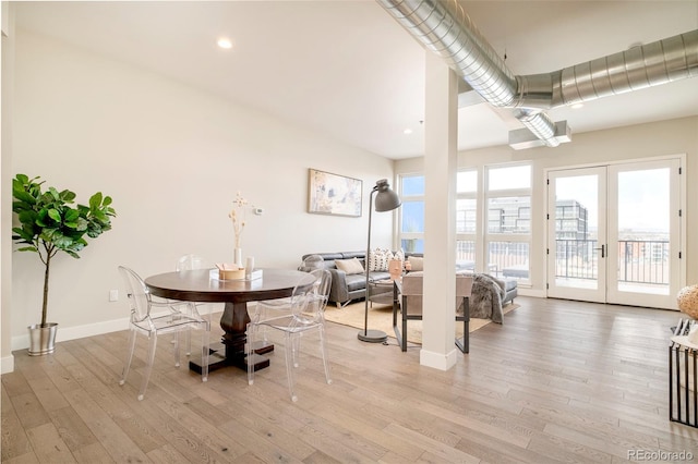 3198 Blake St Unit 502, Denver, CO 80205 - dining space with light wood-style floors, french doors, and recessed lighting