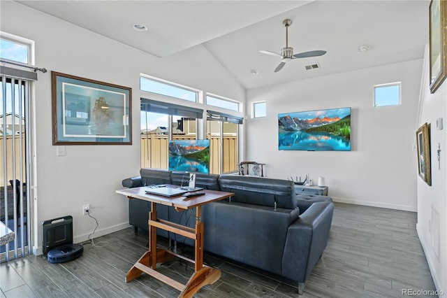 living area featuring baseboards, visible vents, a ceiling fan, lofted ceiling, and wood finished floors