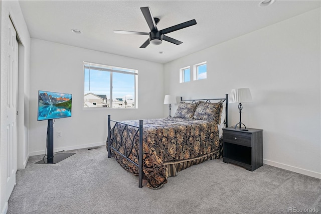 bedroom with carpet flooring, a ceiling fan, and baseboards