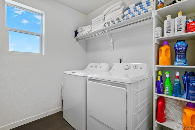 laundry room with laundry area, baseboards, dark wood-style floors, and washer and dryer