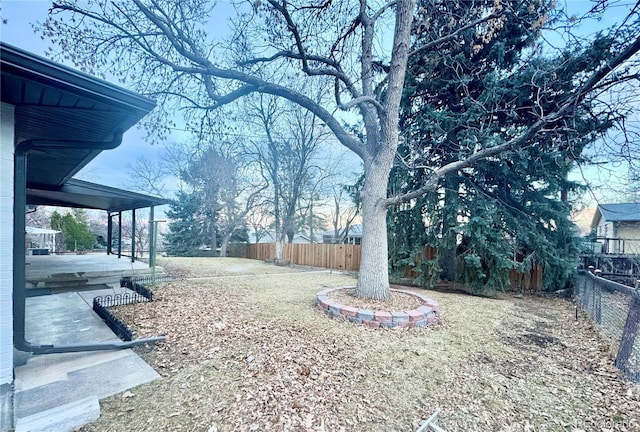 view of yard with a fenced backyard and a patio