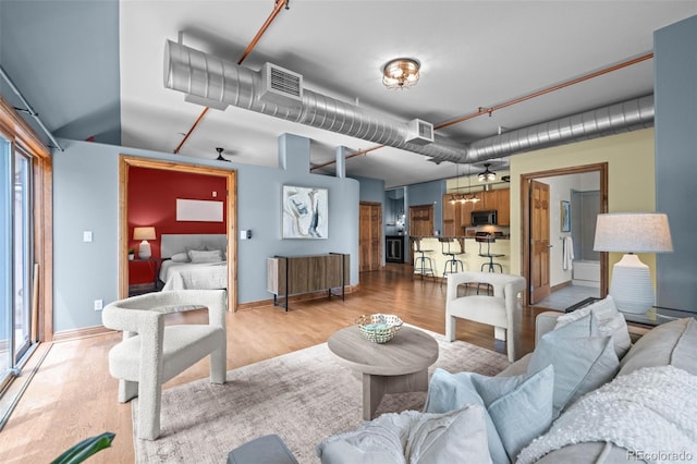3299 Lowell Blvd Unit 204, Denver, CO 80211 - living area with wood finished floors and baseboards