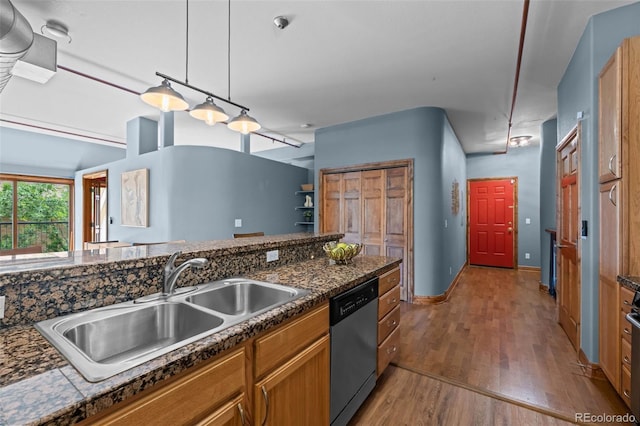3299 Lowell Blvd Unit 204, Denver, CO 80211 - kitchen with stainless steel dishwasher, a sink, dark countertops, wood finished floors, and brown cabinets