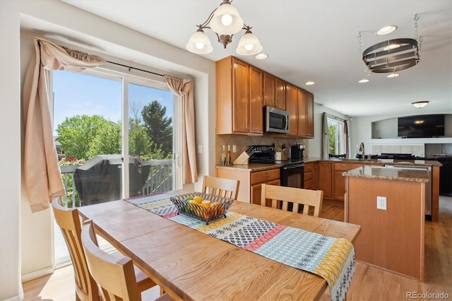 11866 High Desert Rd, Parker, CO 80134 - dining area with light wood finished floors, recessed lighting, and a chandelier