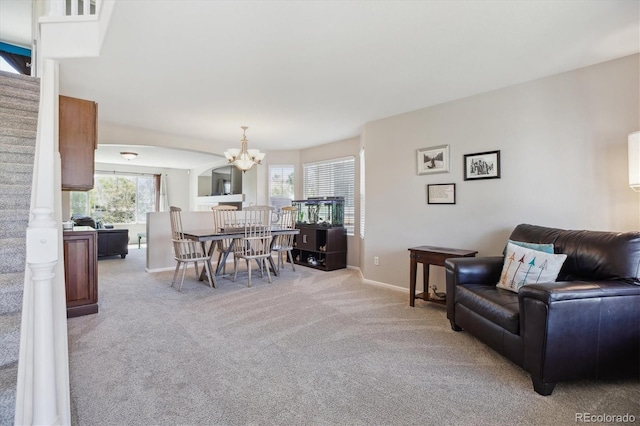 11866 High Desert Rd, Parker, CO 80134 - living area featuring a chandelier, light colored carpet, baseboards, and stairs