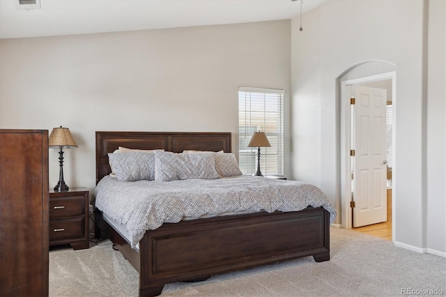 11866 High Desert Rd, Parker, CO 80134 - carpeted bedroom featuring high vaulted ceiling, baseboards, and arched walkways
