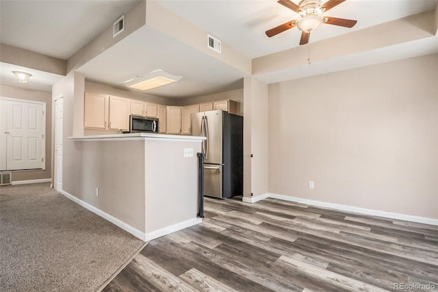 8707 E Florida Ave Unit 709, Denver, CO 80247 - kitchen with stainless steel appliances, baseboards, a ceiling fan, dark wood-style flooring, and a peninsula