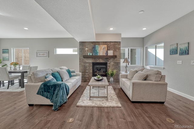 living room featuring hardwood / wood-style floors and a textured ceiling