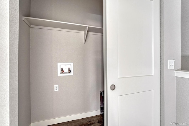 clothes washing area with dark hardwood / wood-style flooring and hookup for a washing machine