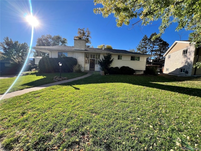2789 S Ivan Way, Denver, CO 80227 - ranch-style house with a front yard and a chimney