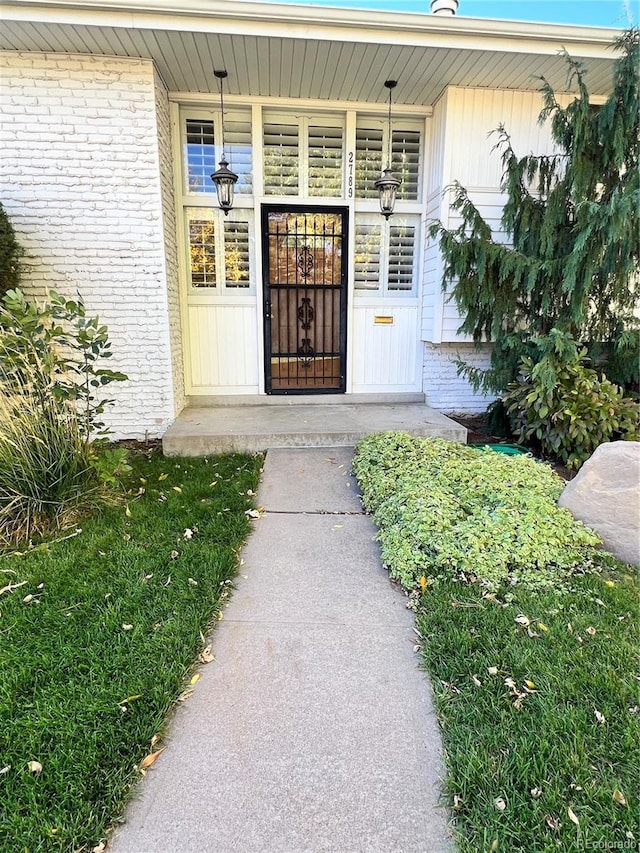 2789 S Ivan Way, Denver, CO 80227 - property entrance featuring brick siding and a porch