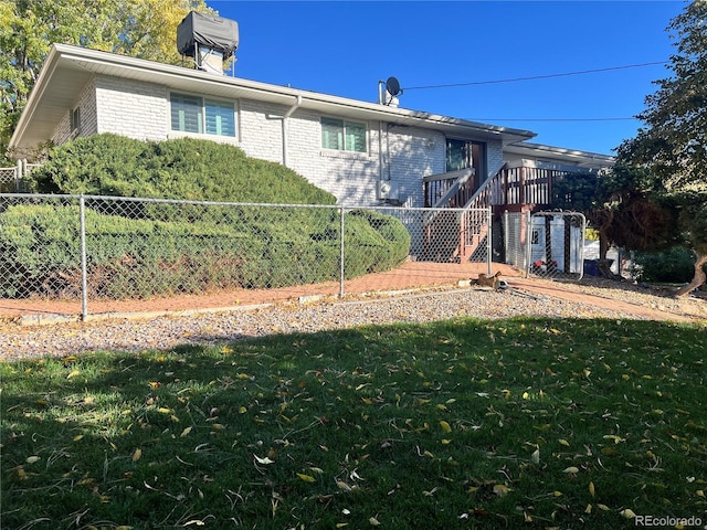 2789 S Ivan Way, Denver, CO 80227 - rear view of property featuring brick siding, a chimney, and stairway