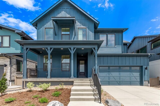 5608 Grandville Ave, Longmont, CO 80503 - view of front of property with covered porch, board and batten siding, and driveway