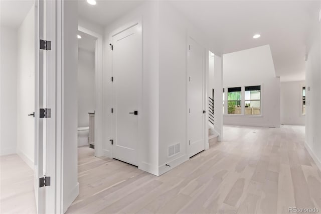 5608 Grandville Ave, Longmont, CO 80503 - hall featuring light wood finished floors, recessed lighting, and stairs