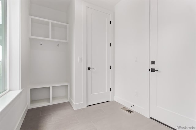 5608 Grandville Ave, Longmont, CO 80503 - mudroom featuring baseboards and tile patterned flooring