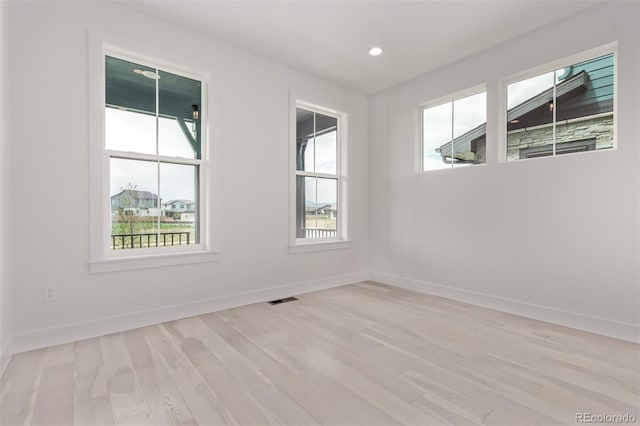 5608 Grandville Ave, Longmont, CO 80503 - unfurnished room featuring plenty of natural light, light wood-style floors, and recessed lighting