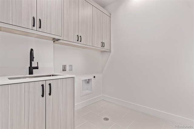 5608 Grandville Ave, Longmont, CO 80503 - washroom with cabinet space, hookup for an electric dryer, and washer hookup