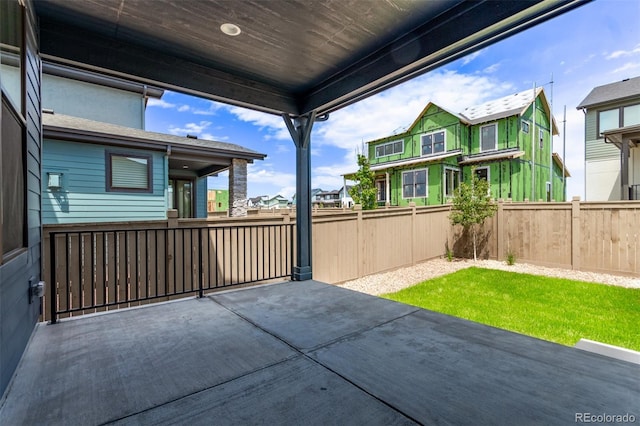 5608 Grandville Ave, Longmont, CO 80503 - fenced backyard with a patio area and a residential view