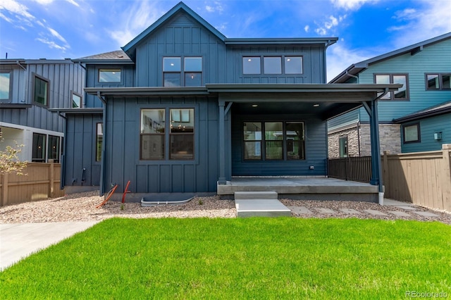 5608 Grandville Ave, Longmont, CO 80503 - view of front facade featuring covered porch and board and batten siding