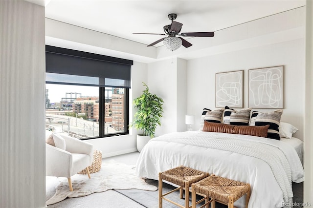 bedroom with ceiling fan and carpet floors