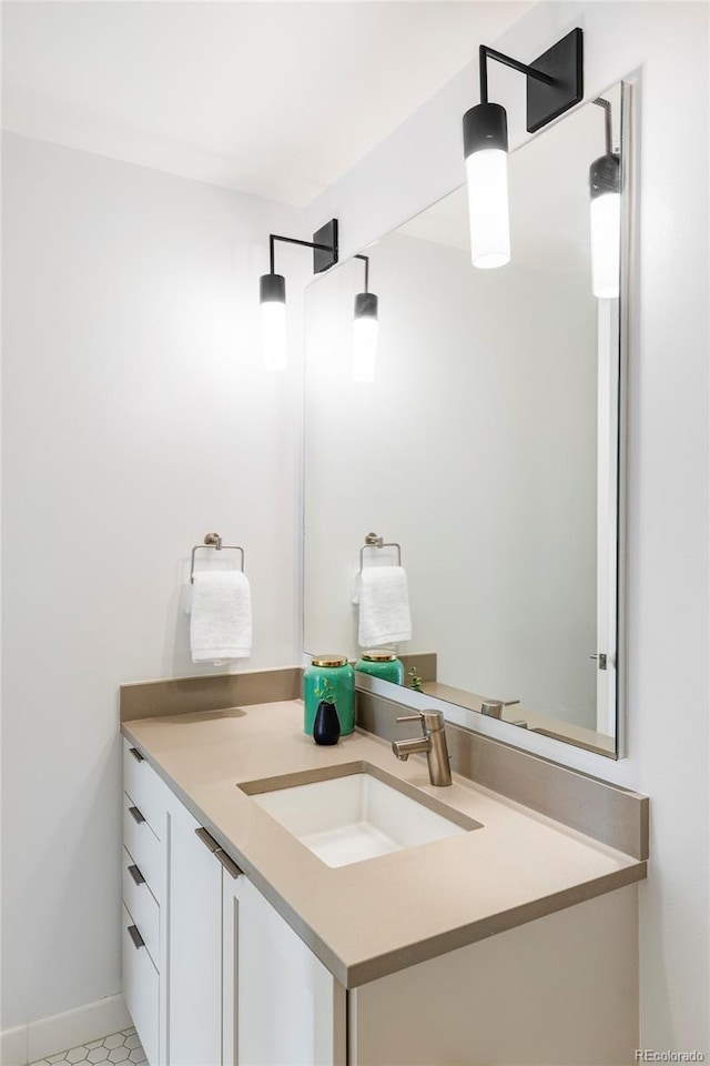 bathroom with tile patterned flooring and vanity