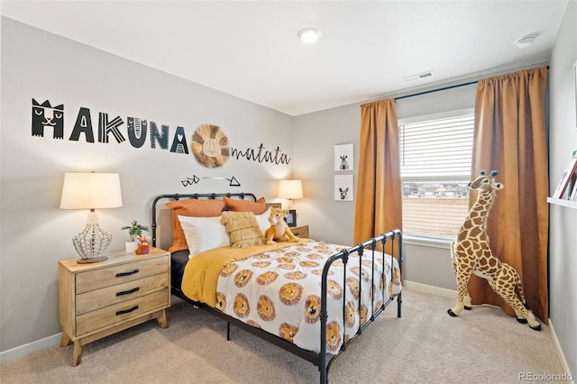 bedroom with light carpet, visible vents, and baseboards