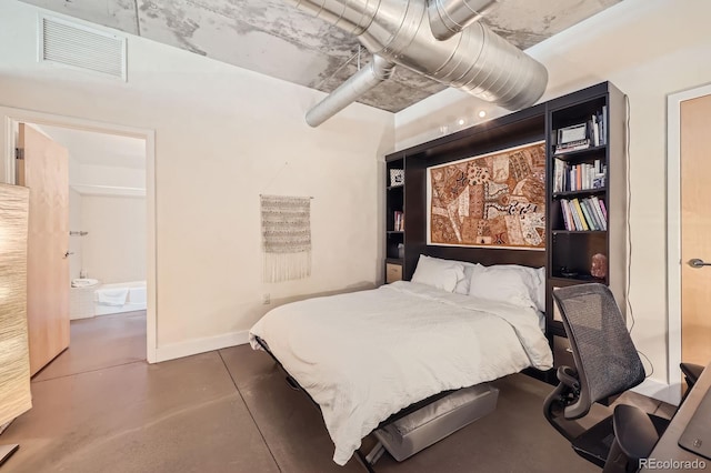 bedroom with finished concrete flooring, visible vents, and baseboards