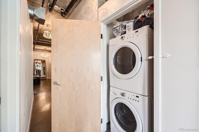 laundry area with stacked washing maching and dryer and laundry area