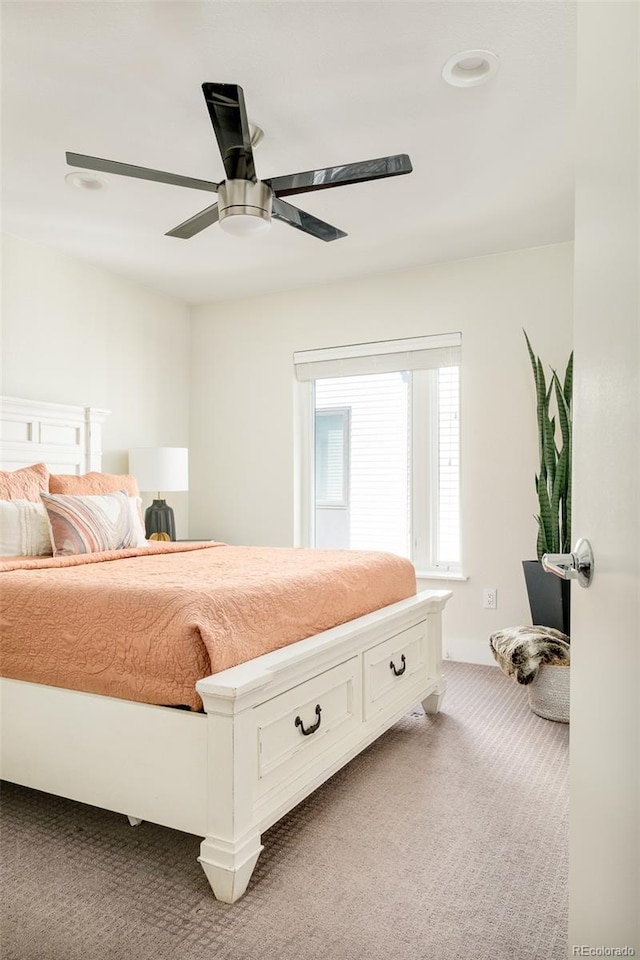 carpeted bedroom featuring a ceiling fan