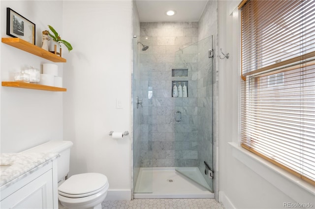 full bath featuring toilet, baseboards, a shower stall, and tile patterned floors