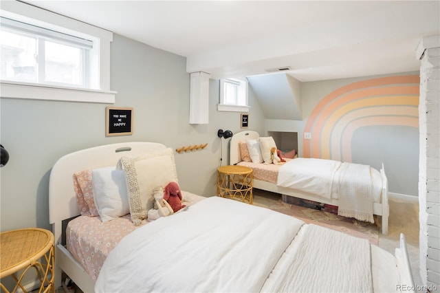 carpeted bedroom featuring visible vents