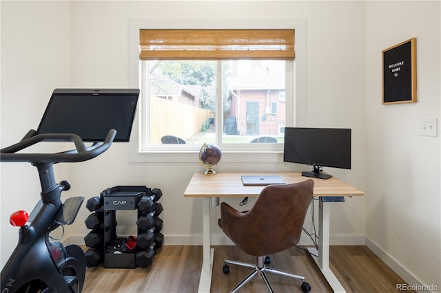 office with baseboards and wood finished floors